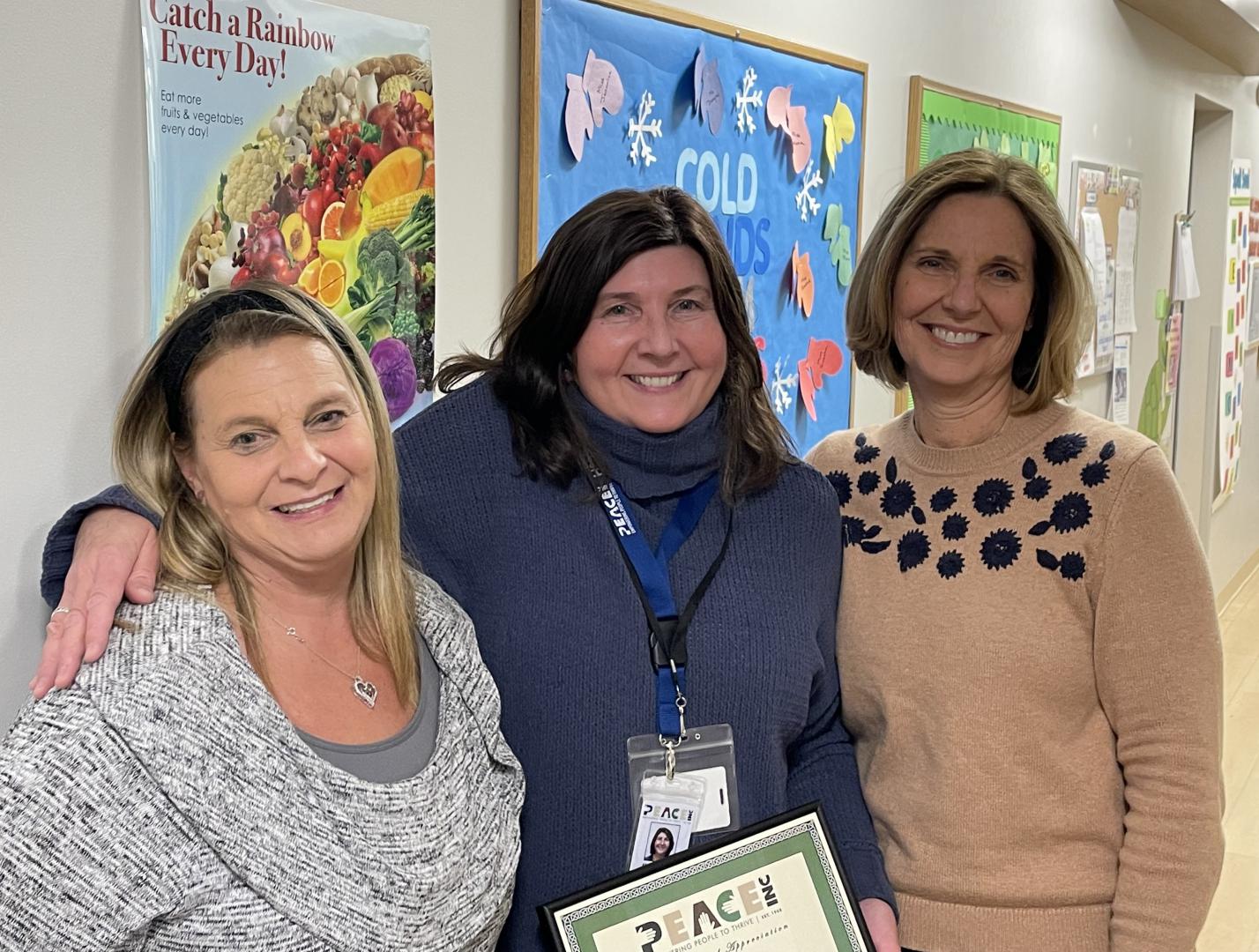 Employee of the Month Mary DeVore (center) with HS/EHS Partnerships Coordinator Kim Senke and Executive Director Carolyn Brown.